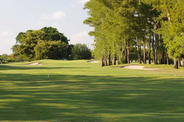 A sunny day view of a green at Woodlands Country Club.