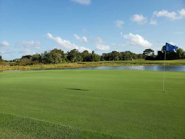 A view of a green with water coming into play at Indian River Preserve Golf Club.