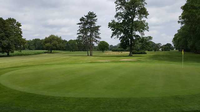 A sunny day view of a green at South Shore Golf Club.