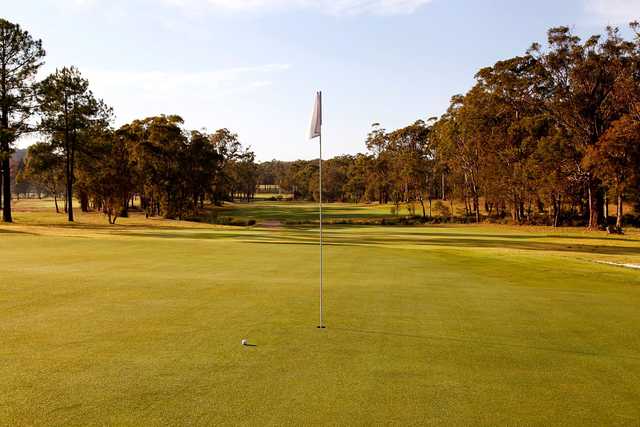 A sunny day view of a hole at Toronto Country Club.