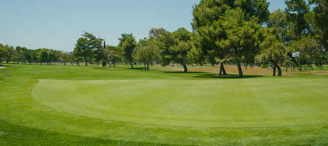 A sunny day view of a hole at Diablo Creek Golf Course.