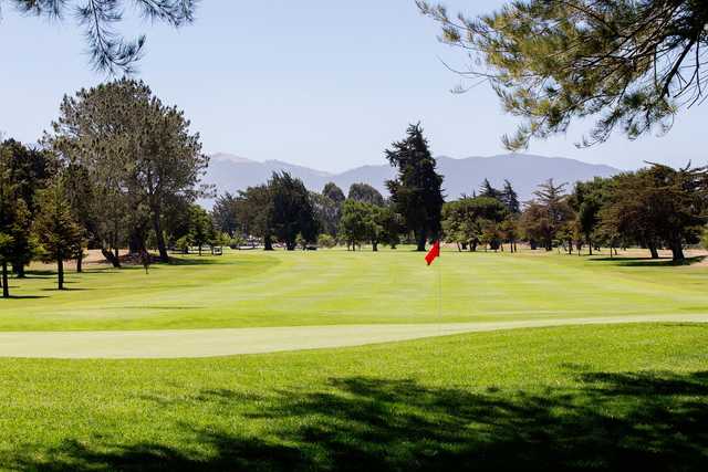 A sunny day view of a hole at Salinas Fairways Golf Course.