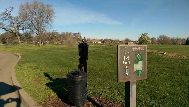 A view from the 15th tee sign at Woodcreek Golf Club.