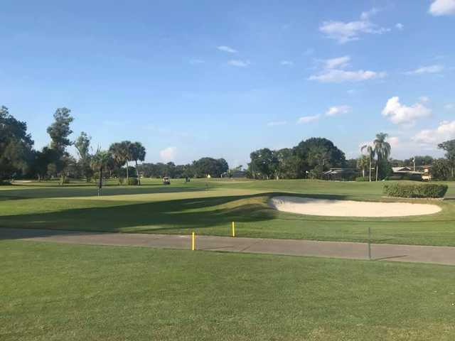 A view of a green protected by a bunker at Seminole Lake Country Club.