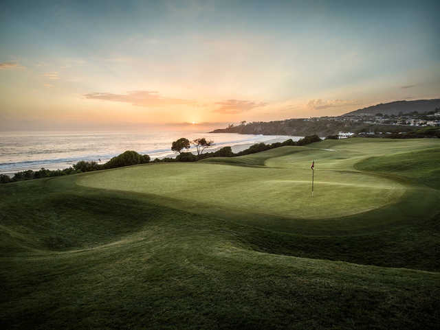 A sunset view of a green at Monarch Beach Golf Links.