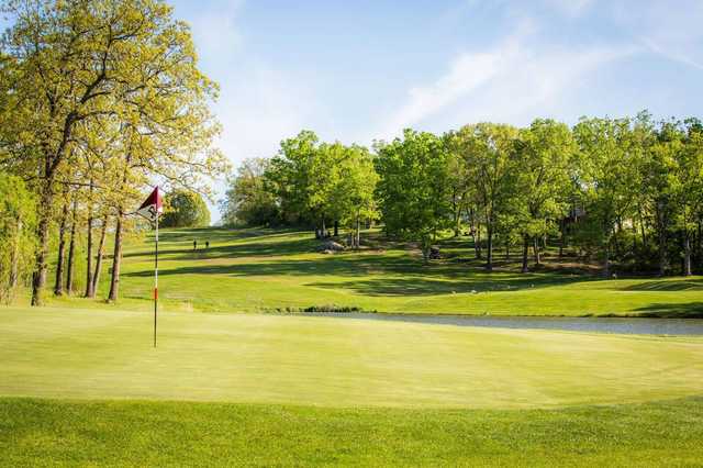 A view of a hole with water in background at Indian Rock Golf Club.