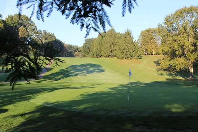 A sunny day view of a hole at Yankee Run Golf Course.