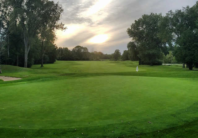 A sunset view of a hole at Currie Golf Course.