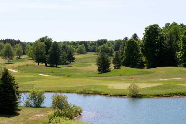 A view of a green with water coming into play at Mistwood Golf Course.