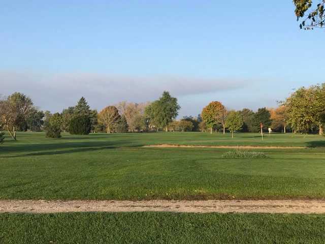 A sunny day view of a hole at The Lakes Country Club.