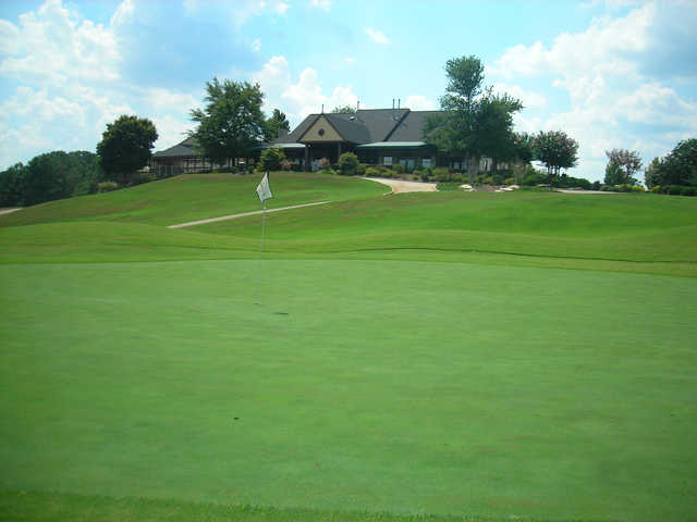 A view of a hole and the clubhouse at the Country Club of Gwinnett.