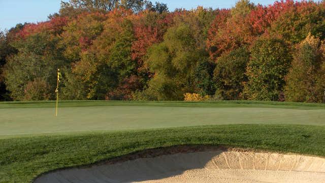 A fall day view of a hole at Colts Neck Golf Club.