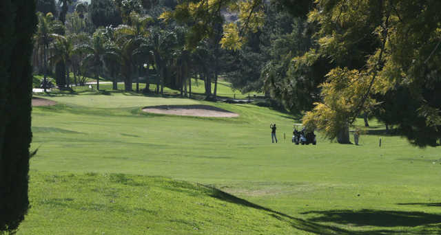 A sunny day view of a hole at Indian Hills Golf Club.