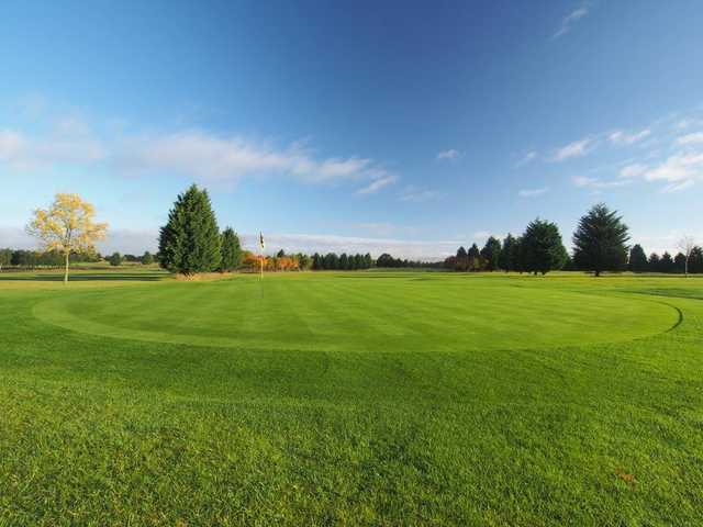 A sunny day view of a green at Bird Hills Golf Centre.
