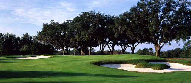 A view of the 11th green surrounded by bunkers at Brooksville Country Club.