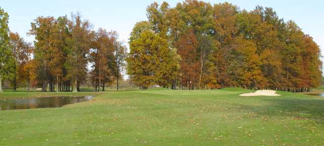 A fall day view of a hole at Dragon Ranch Golf Club.