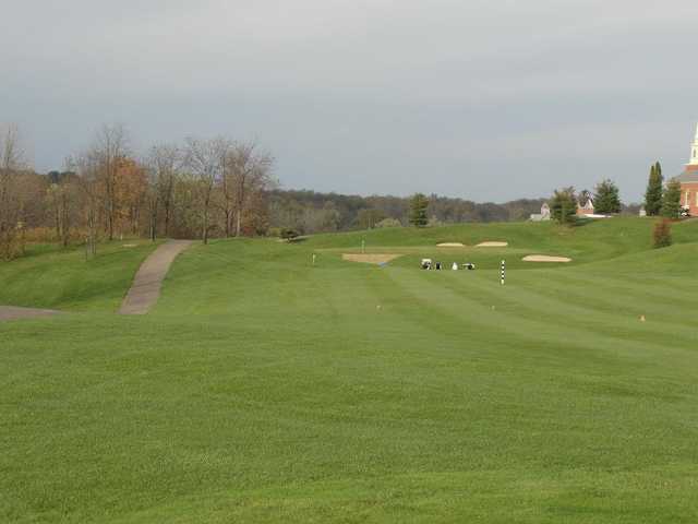 A fall day view from the left side of a fairway at Chapel Hill Golf Course .